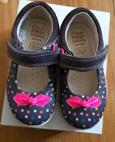 First paid of clarks shoes, navy blue with colourful dots on and a pink bow