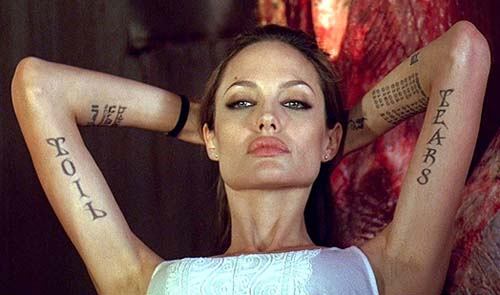 Angelina Jolie tattoos. She has a history of "cutting" herself and her sex