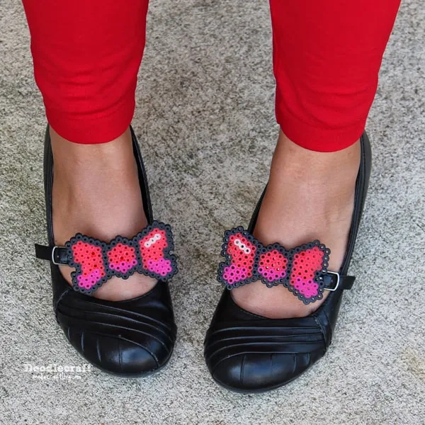 Perler beads melted into darling little bows and attached to shoe clips and attached to black maryjanes