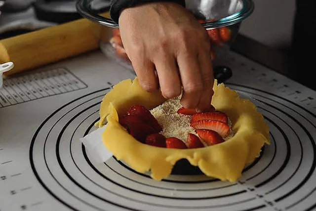 arrange strawberries for galette