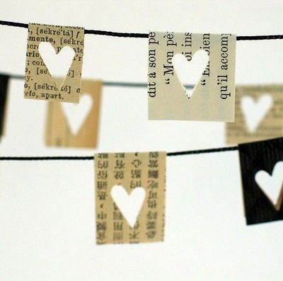 Lovely vintage looking bunting made out of old books with a heart shaped hole punch