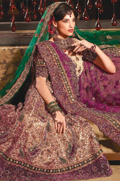 Make a style statement dressed in this violet and gold shade lehenga choli