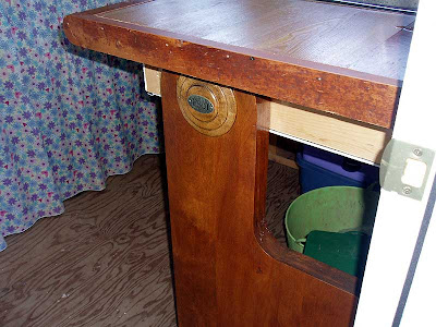 The upright for the sink counter is the end cap from an old church pew. You can still see the row marker if you look closely.