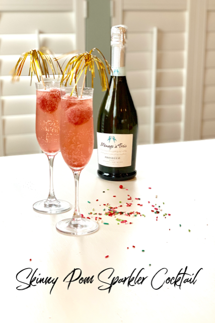 Skinny Pom Sparkler Cocktail is a drink served in a champagne glass with homemade sorbet and champagne