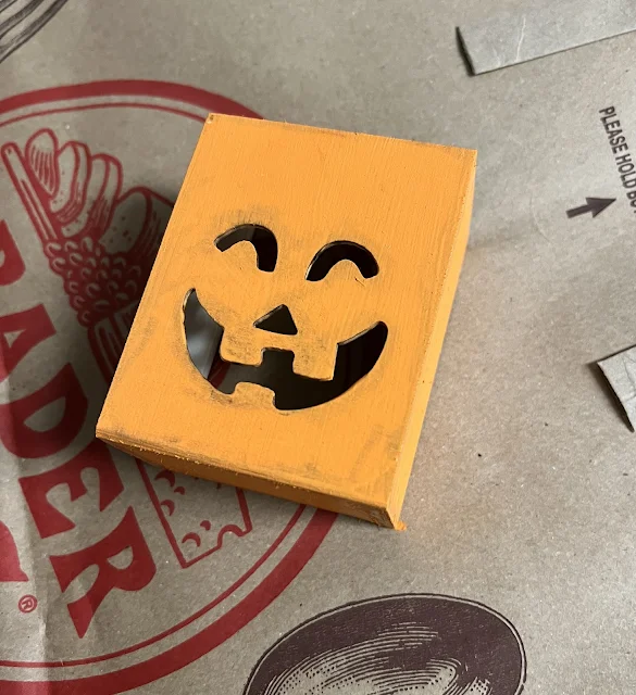 Photo of a Jack O' Lantern box from Dollar Tree painted orange.