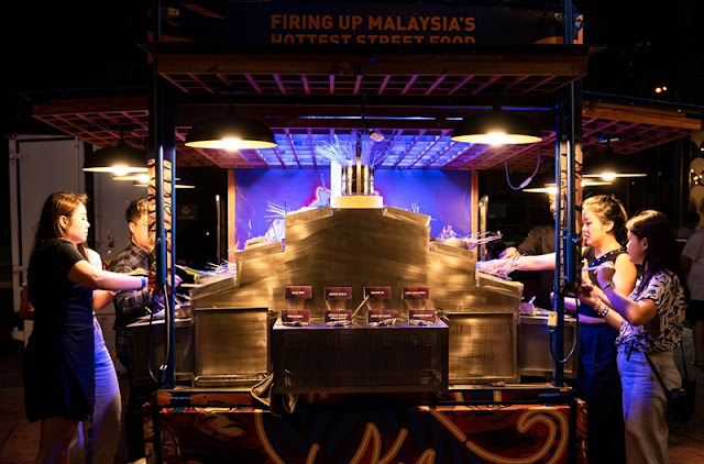 Guests trying out the selection of familiar and innovative street food at the Tiger Crystal Fire Truck