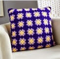 http://www.letsknit.co.uk/free-knitting-patterns/easy-crochet-granny-square-cushion