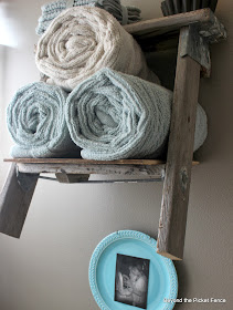 Under$75 bathroom makeover ladder shelf towel holder http://bec4-beyondthepicketfence.blogspot.com/2013/10/how-to-makeover-bathroom-for-under-75.html