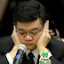 Atty. Vitaliano Aguirre is photographed covering his ears!