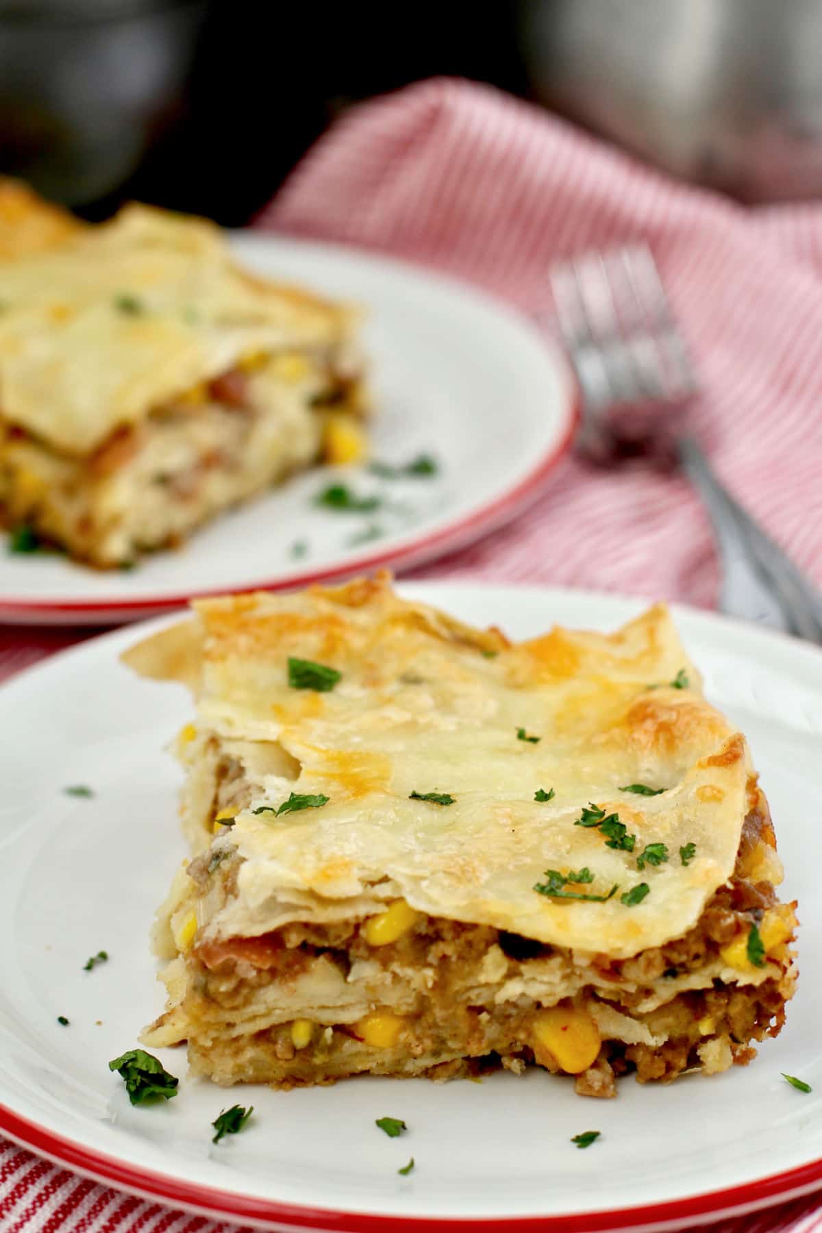 Mexican Chicken Lasagna servings on plates.