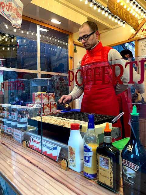 man cooking poffertjes at Bremen Christmas market