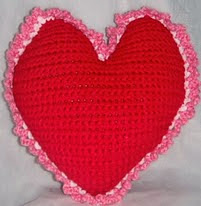 http://www.ravelry.com/patterns/library/free-pattern--heart-pillow