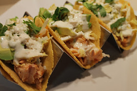 Salmon tacos with cabbage slaw, avocado and chipotle lime crema