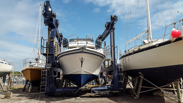 Photo of Ravensdale in the marina's hoist after we had her out for antifouling last year