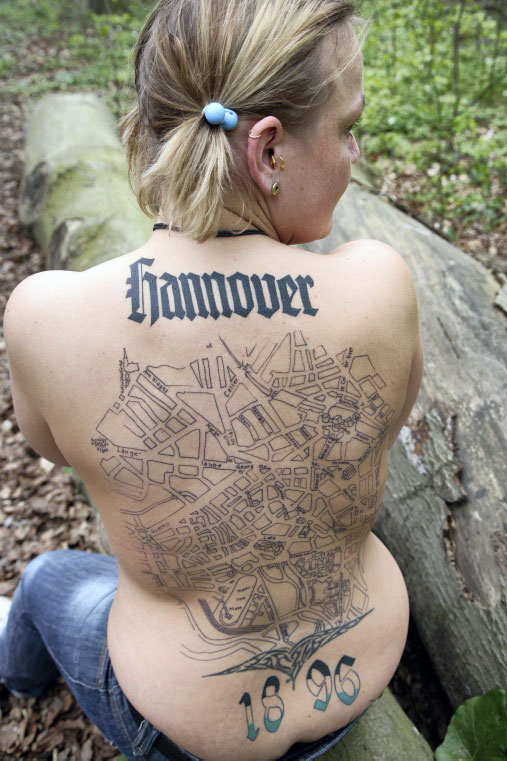 old english writing tattoo. back tattoos