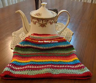 Sweet Nothings crochet free crochet pattern blog, free crochet pattern for a rainbow colored tea cozy,  photo of the tea cozy,