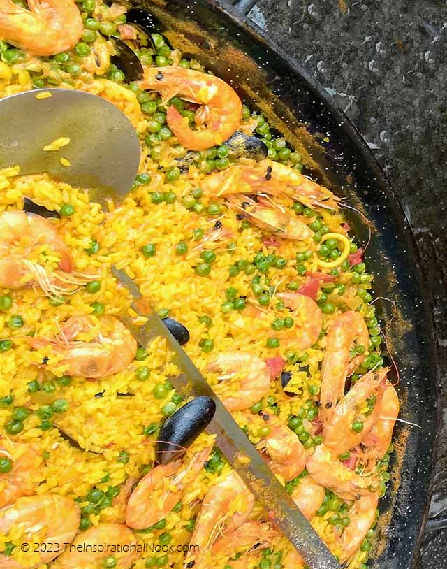 Seafood paella full of king prawns and mussels at Notting Hill's Portobello Market, London.