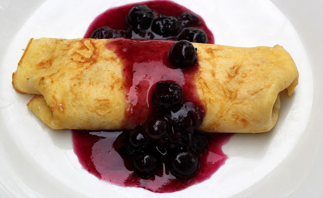 Get our simple cheese blintz crepe recipe with fresh homemade blueberry sauce. It's the perfect brunch, breakfast, or dessert dish!