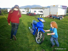 boys chasing around a motorbike 