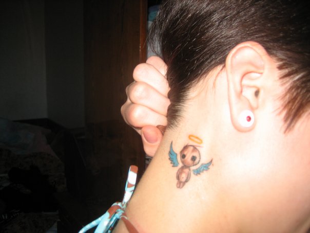 Star tattoos: Stars are small, symbolic, Small angel tattoo behind ear.