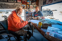 old man signing book