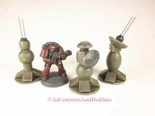 Group of military field tech devices for 25 to 28 mm scale science fiction war games and role-playing games.