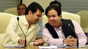 photo of anurag thakur and rajiv shukla sitting and talking 