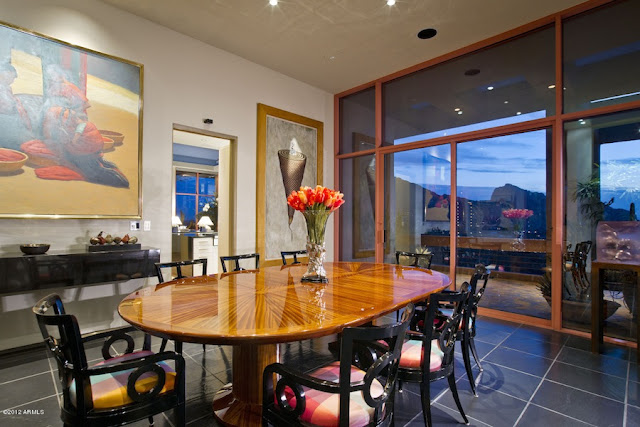 Oval dining table with black chairs