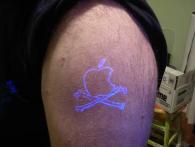 Southern Cross uv tattoo on shoulder with apple tattoo designs