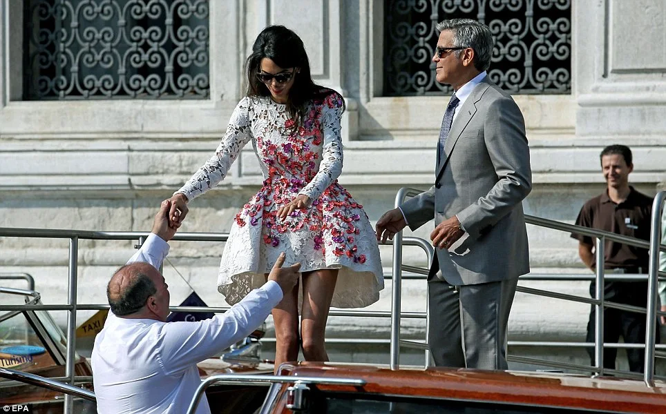 Amal Alamuddin makes first appearance as George Clooney's wife in Venice in a Giambattista Valli dress