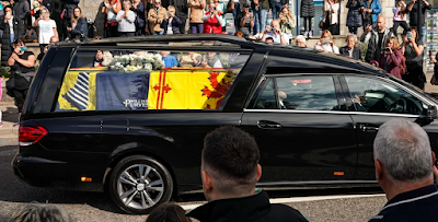 Queen Elizabeth II lies in state after solemn procession