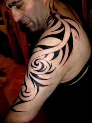 tribal dragon tattoo design can go from one part of the body to another for