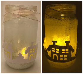 A winter lantern craft lit up with candle