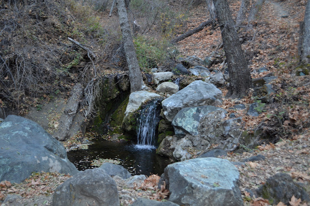 little waterfall beside old water collection