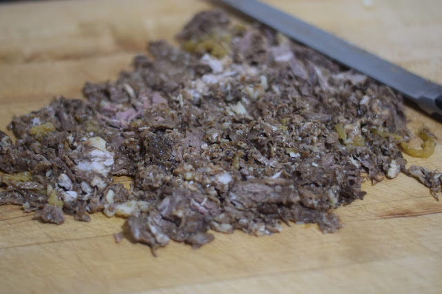 The leftover Mississippi Pot Roast finely chopped on a cutting board. 