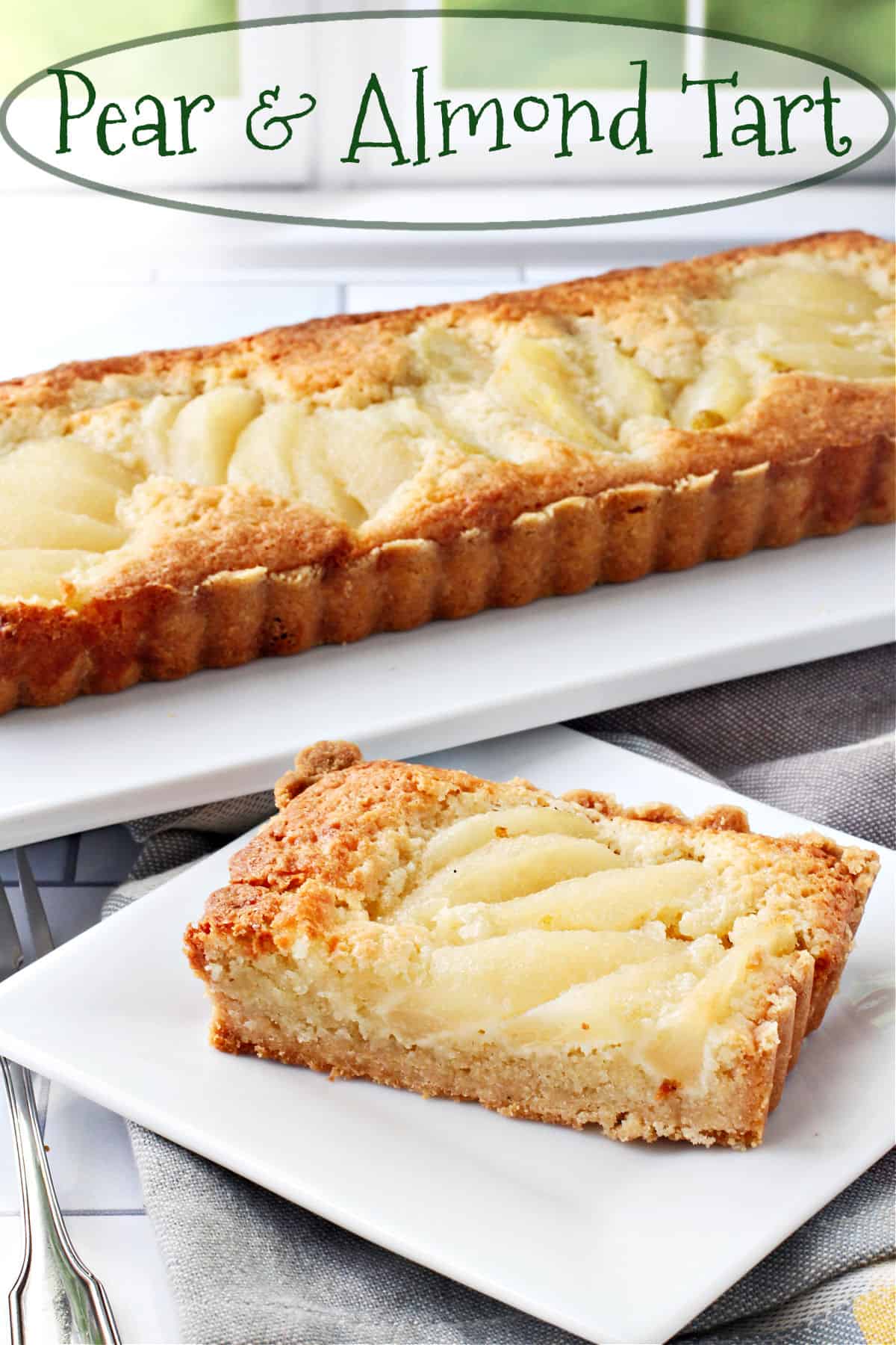 Pear and Almond Tart on a plate in front of the original tart.