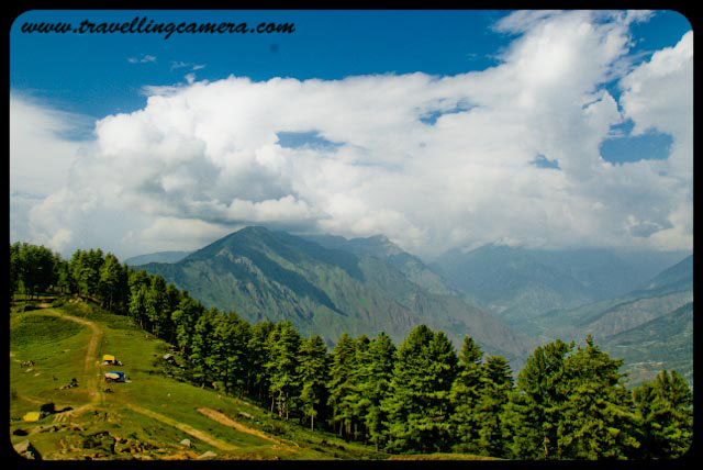 Wonderful trekking experience of Bijli Mahadev @ Kullu-Manali, Himachal Pradesh : Posted by VJ Sharma at www.travellingcamera.com :Last year when I went to Kullu Manali with my college friend, Bijli-Mahadev is the place I liked the most. Its a wonderful place on hill top from where whole Kullu Valley, Manikaran, Malana, Bhuntar and bunch of Apple Orchids can be seen... Here are few views of Bijli Mahadev...Here is the very first view on reaching Bijli Mahadev... You are seeing a yellow path on right side of the photograph, which is a road connected through some small villages and apple orchids... It connects this Bijli Mahadev with Naggar... This road is not recommended if there are rains or probability of rains...Here is the road I was talking about... It a nice walk from Bijli Mahadev...but don't go far..A view to hills in parallel with clouds...Photograph clicked while coming back towards Bijli Mahadev from that road which connects it with Naggar...Few local people sitting on an edge of Bijli Mahadev which is giving a view of Malana Village and Kasol region...Other side of Bijli Mahadev which has dense forest of Deodars on a steep hill...Friends walking around Bijli Mahadev and enjoying the chilly/fast winds here...Radio Transmission Anteena near Bijli Mahadev Temple...A view of Beas River and Bhuntar Airport from Bijli Mahadev...Closer view to Bhuntar airport from Bijli Mahadev @ Kullu, Himachal Pradesh, INDIA...A closer look to Manali Highway and green fields around it... This has been shot from a an edge of Bijli Mahadev...Closer view to Beas River from Bijli Mahadev @ Kullu, Himachal Pradesh, INDIA...Another shot of Kullu Valley from Bijli Mahadev... Here we can see Beas river flowing on one side of Bhuntar airport...Eagle flying on top of Kullu but still at lower heights as compared to Bijli Mahadev...See this man standing on the edge @ Bijli Mahacdev, Kullu, Himachal Pradesh... Its very surprising to see these cattles having their food with very easy walk on these steep hills...It was lovely experience under clouds with cool winds and having amazing views on three sides... Views to Kullu Twon, valley, Apple Orchids, Bhuntar Airport, Beas river, Malana, Manikaran and Kasol Region...