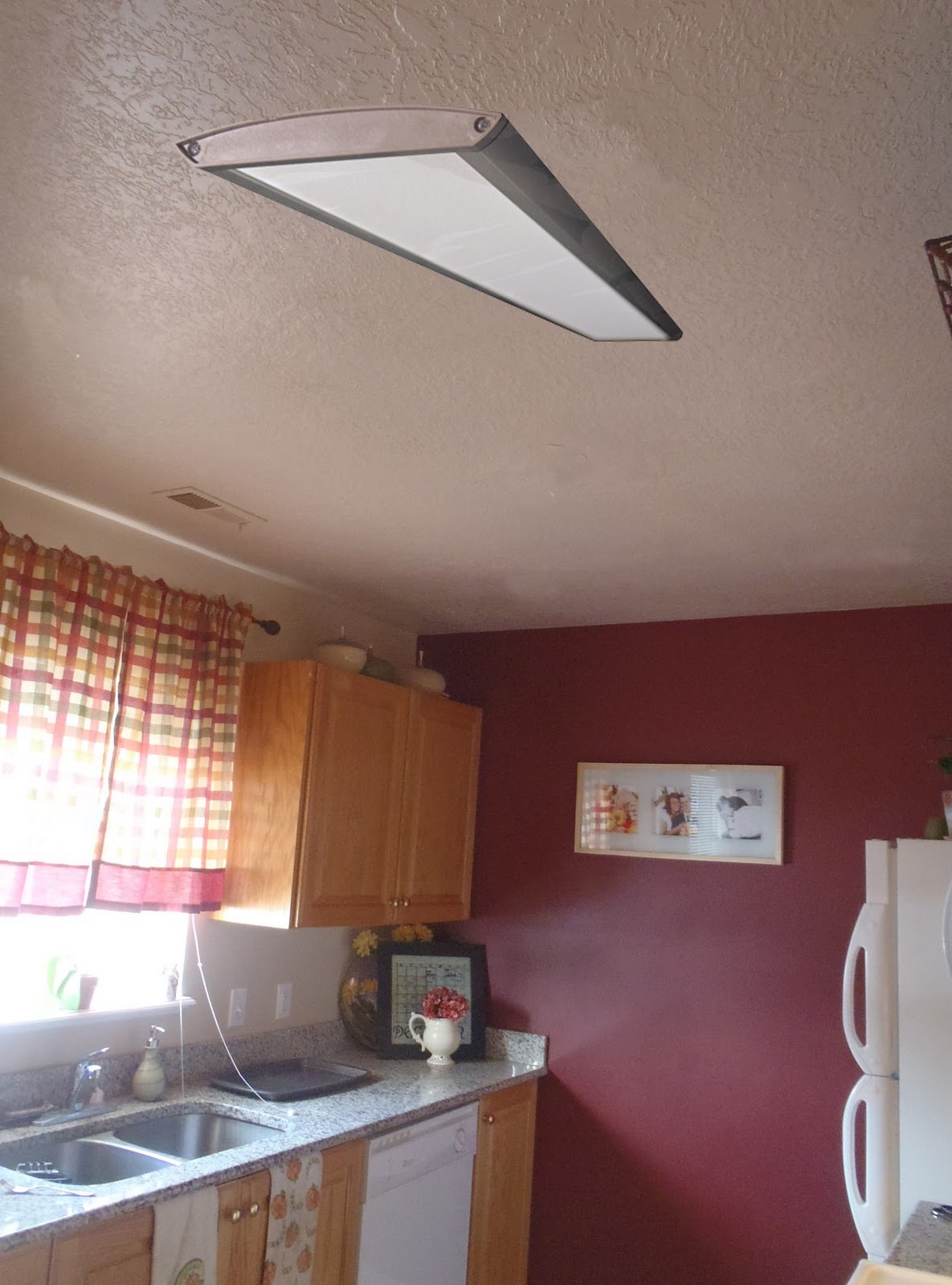 Remodelaholic | Replacing Florescent Kitchen Light With Can Lights