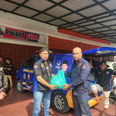 Anggota DPR RI Martin Manurung Melalui DPD Garda Pemuda Nasdem Labuhanbatu Bagikan Paket Sembako 