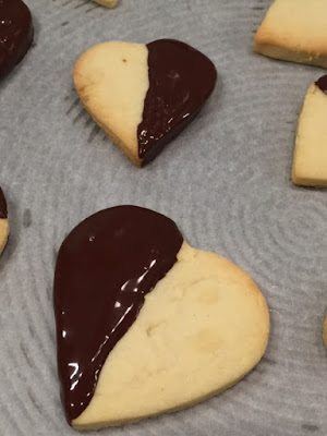 Close up of 2 Chocolate Covered Heart Biscuits