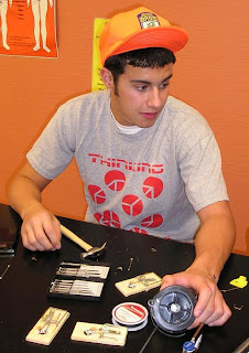 Kris Hansen working on a mousetrap vehicle for SECME Olympiad