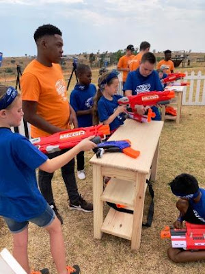 Girls preparing to shoot with Nerf blasters