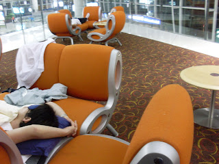 People resting overnight at Hong Kong International Airport