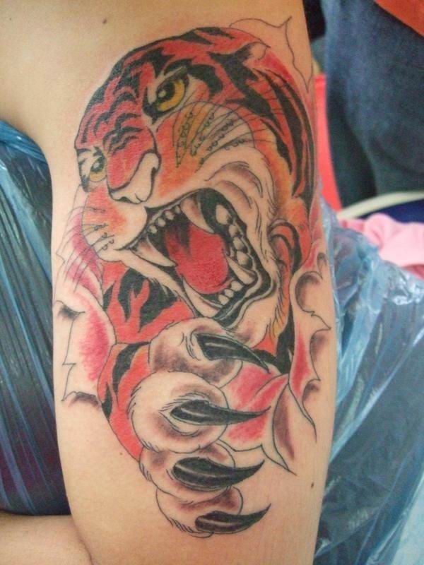 Girls and guys alike will find that a tiger tattoo is the perfect design for 