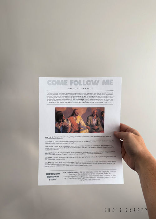 Come Follow Me Printable in front of wall.