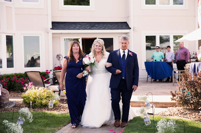 bride walking down isle at new baltimore waterfront wedding