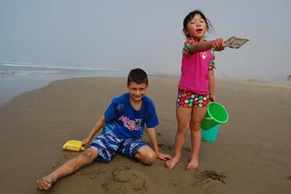 jack and lily playing at the beach