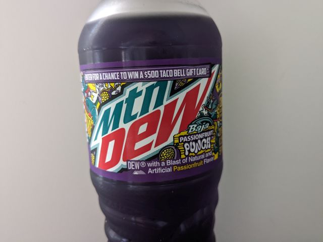 Mtn Dew Baja Blast Passionfruit Punch bottle label close-up.