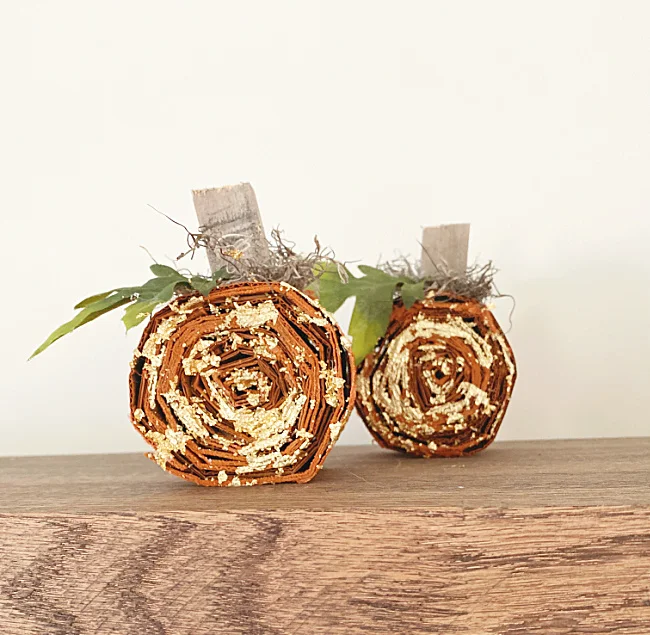 gold leafed pumpkins with stems and leaf