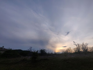 Sun going down behind the edges of a storm